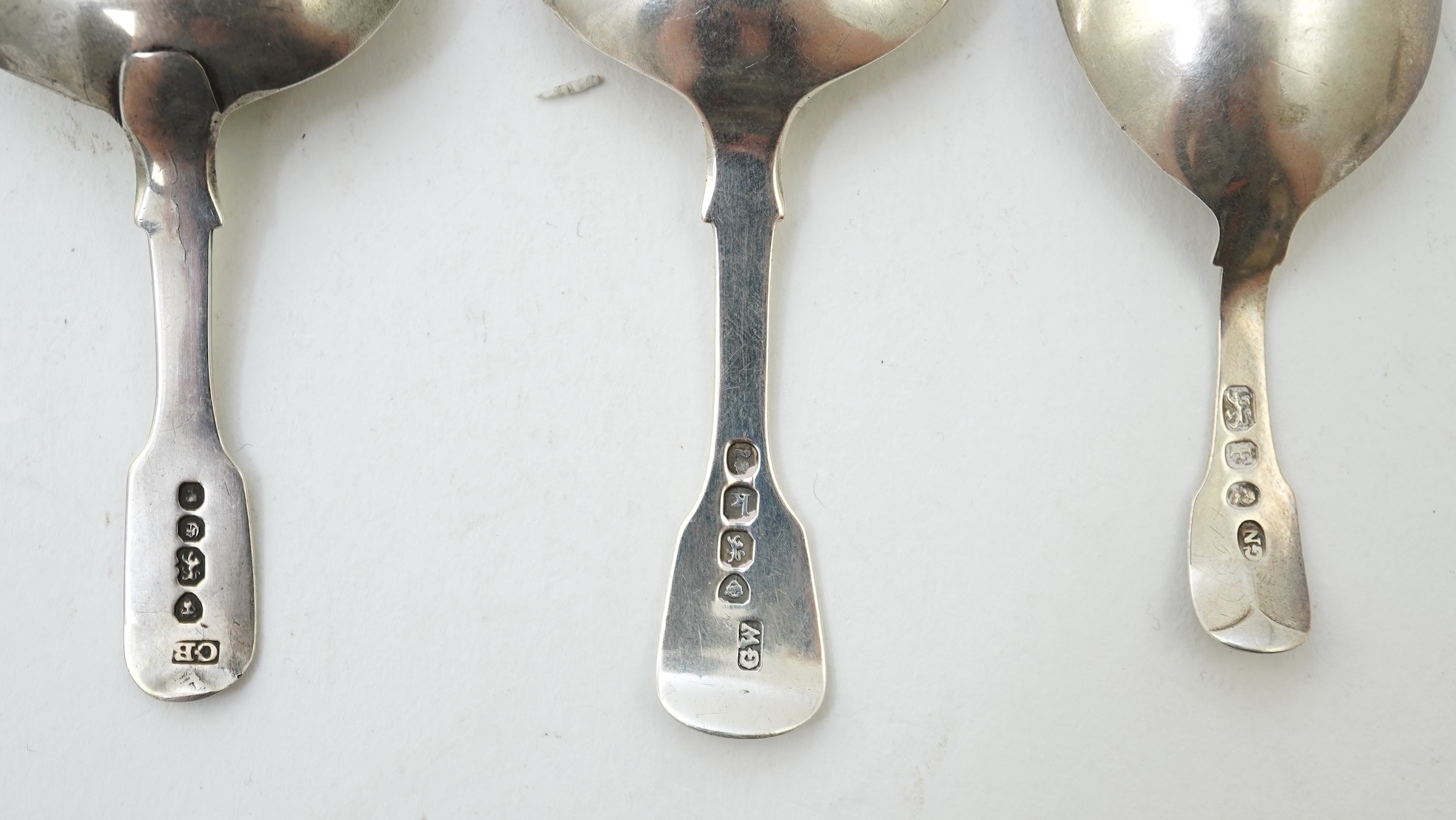 A collection of ten assorted mainly 19th century silver and white metal fiddle pattern caddy spoons